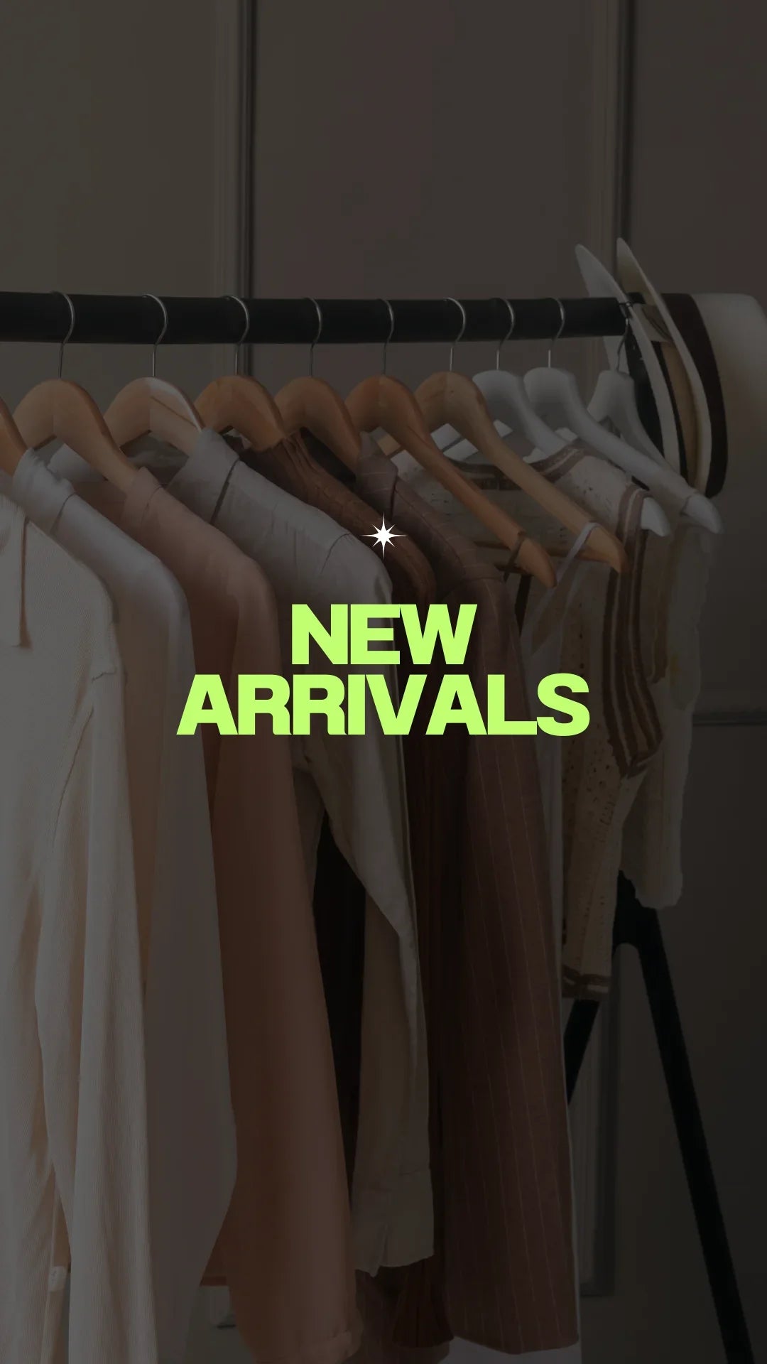 Neutral clothing on hangers with hats, text overlay says 'New Arrivals' in green