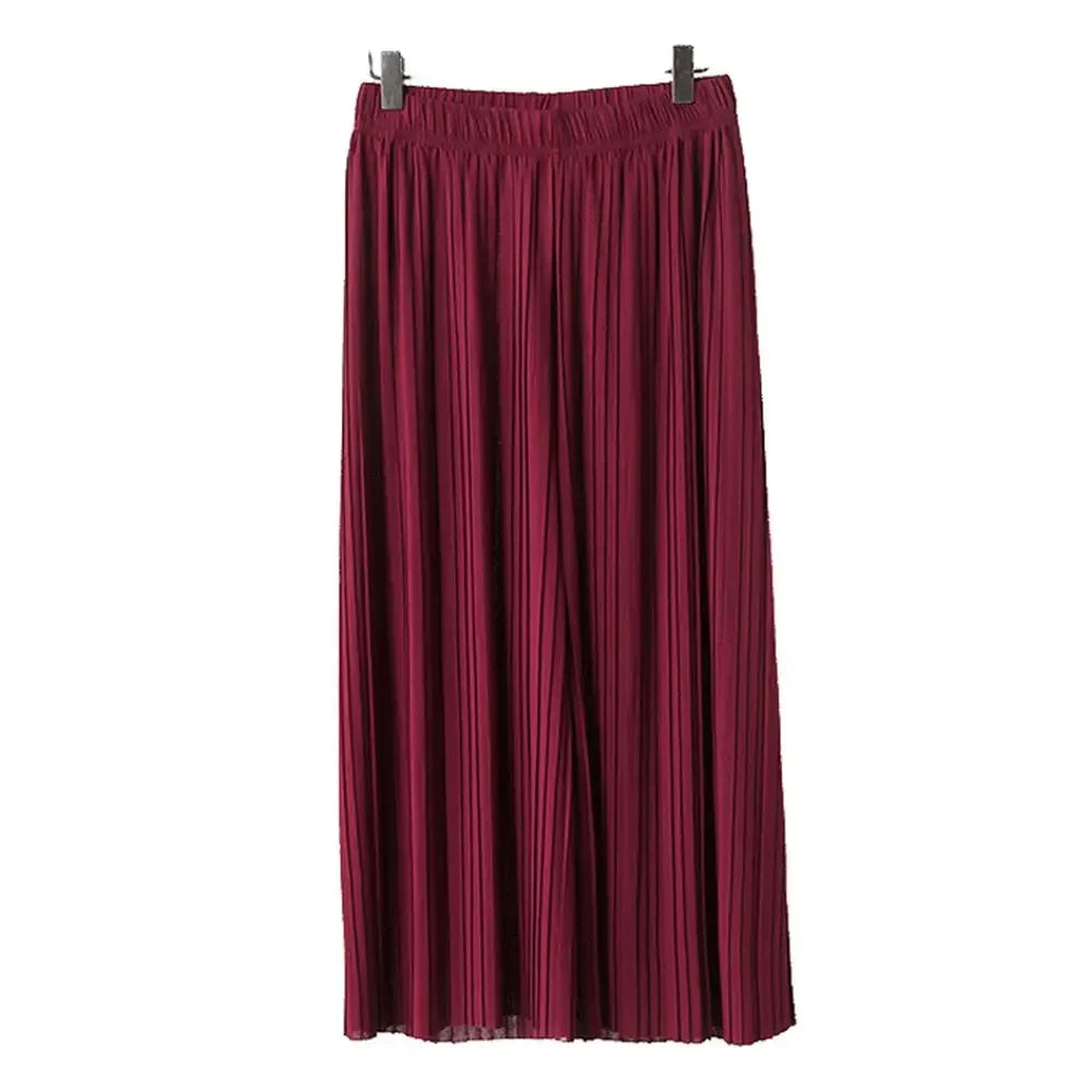Burgundy pleated maxi skirt with an elastic waistband, hanging on a white background