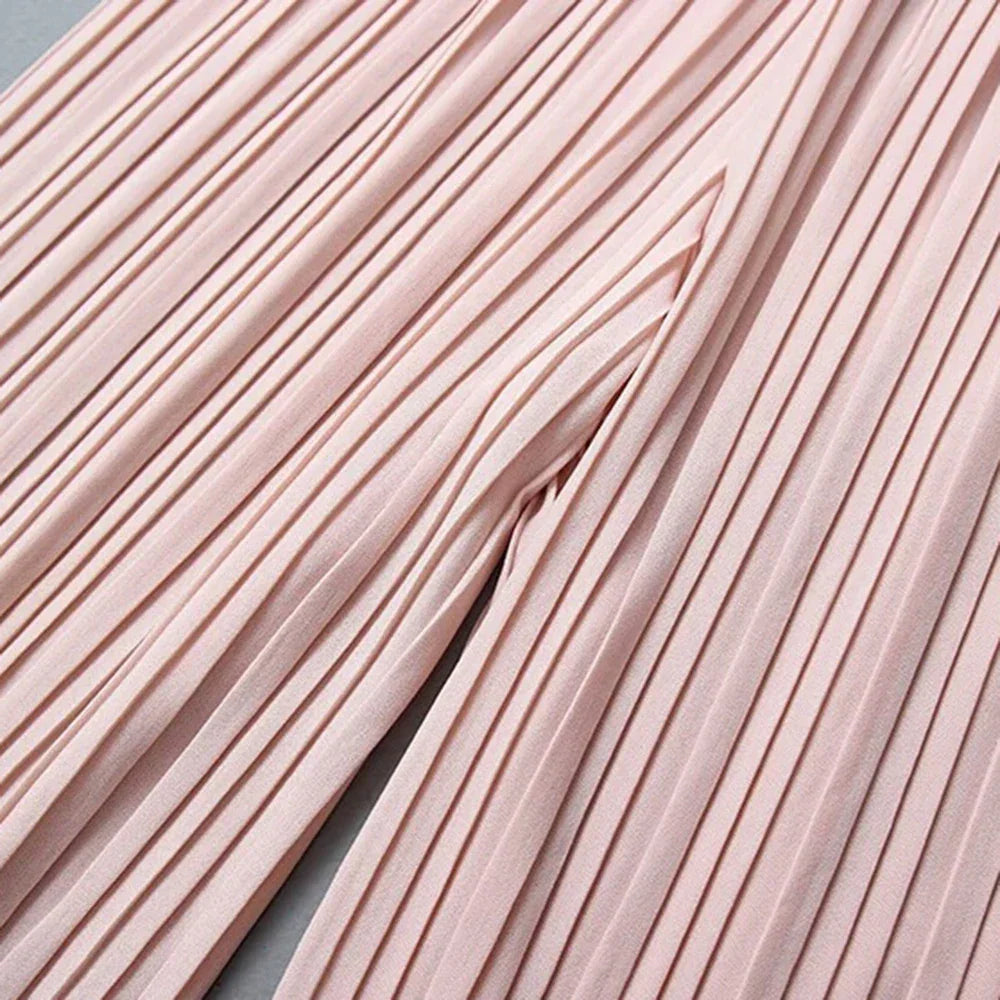 Close-up of light pink pleated fabric texture for fashion or dressmaking