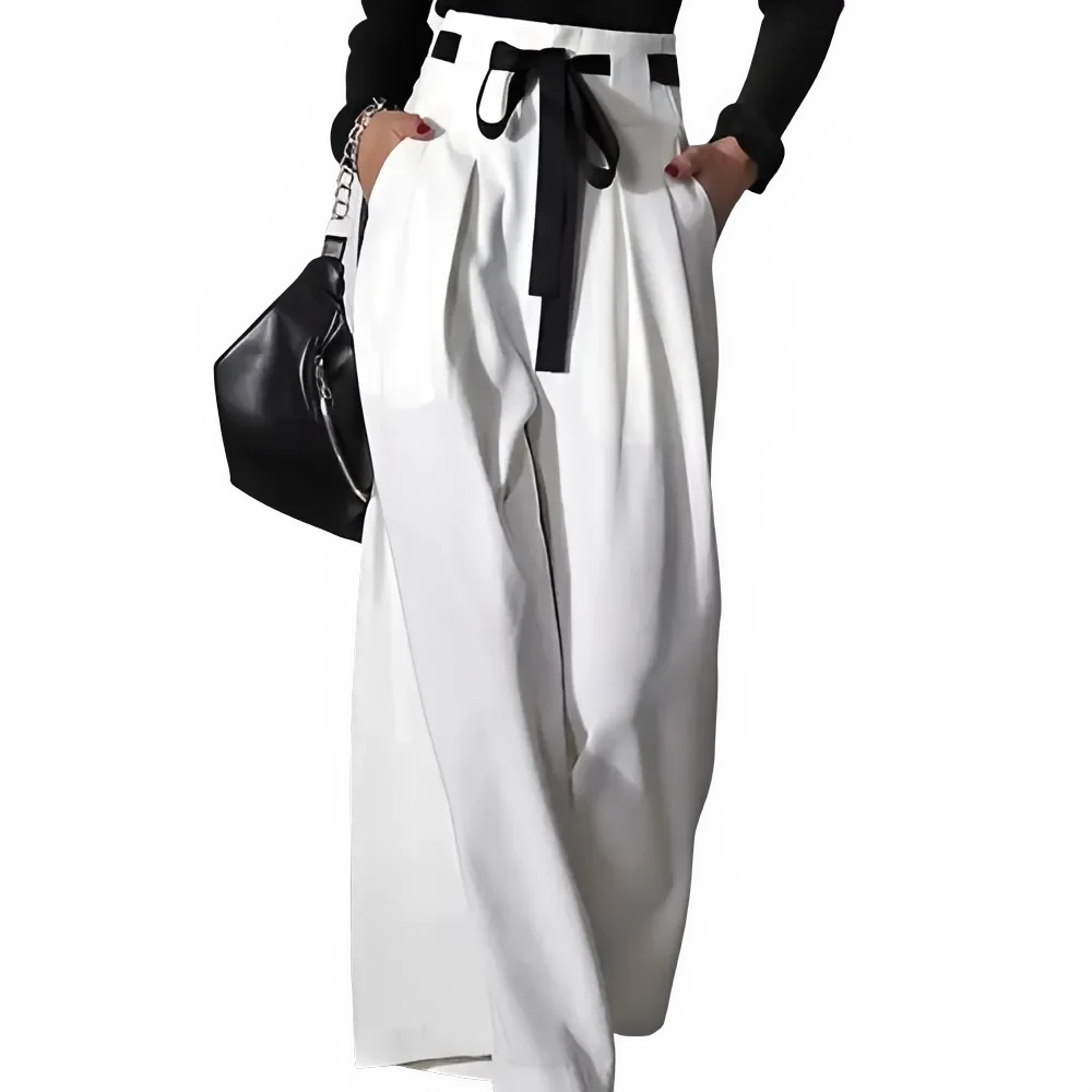 Wide-leg white pants with black bow belt, black top, and black handbag, fashion style